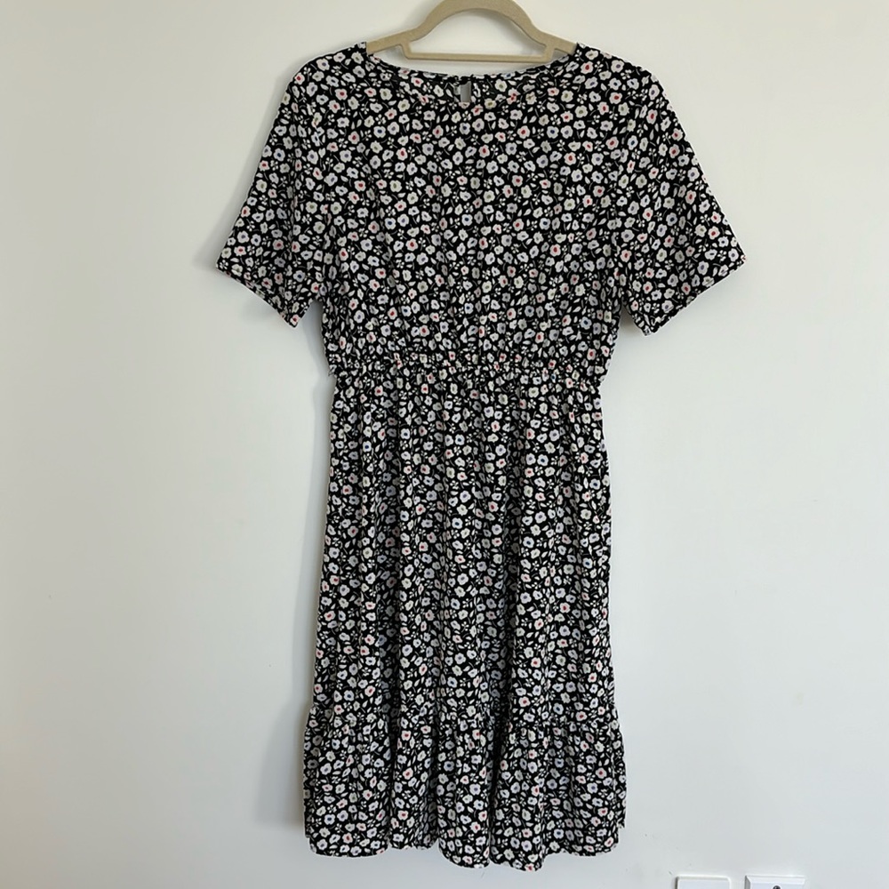 Black and white floral ruffle hem dress